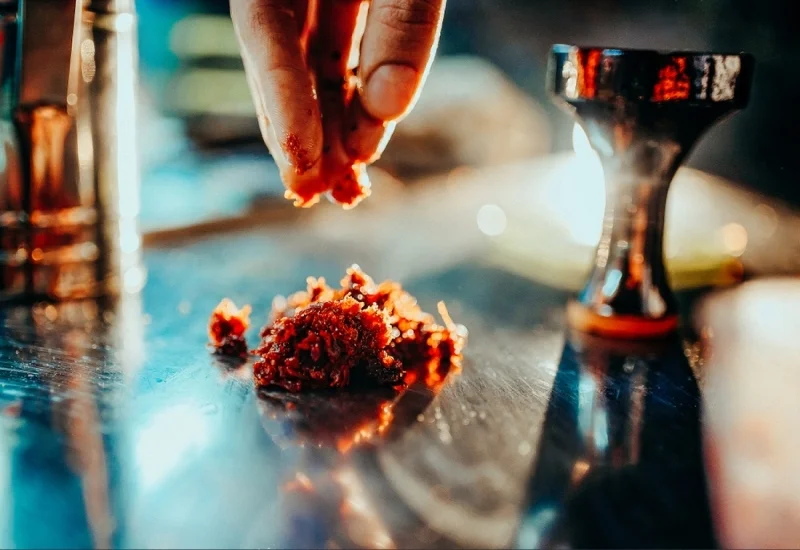 process of making hookah for smoking concept of smoking a hookah and having a good time laying